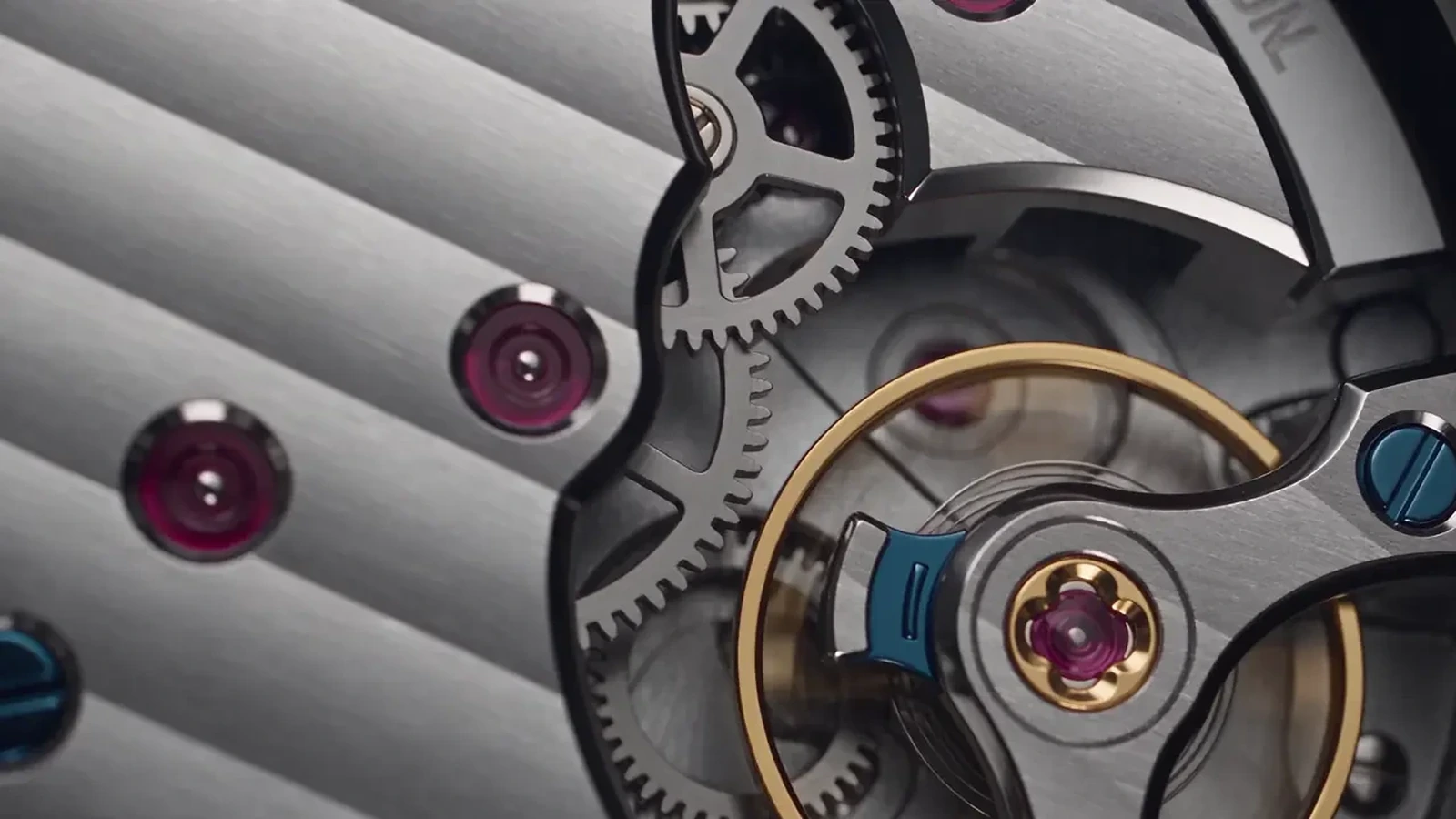 Close-up underside detail of a luxury watch movement showing gears, screws and finishing details